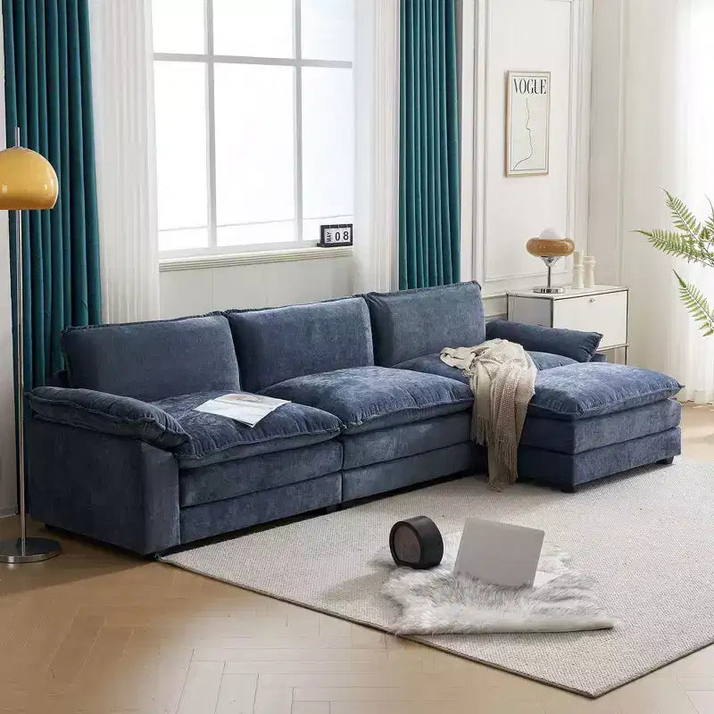 Divano moderno a L a 3 posti con braccioli e piano imbottito da 120 pollici, colore beige con pouf