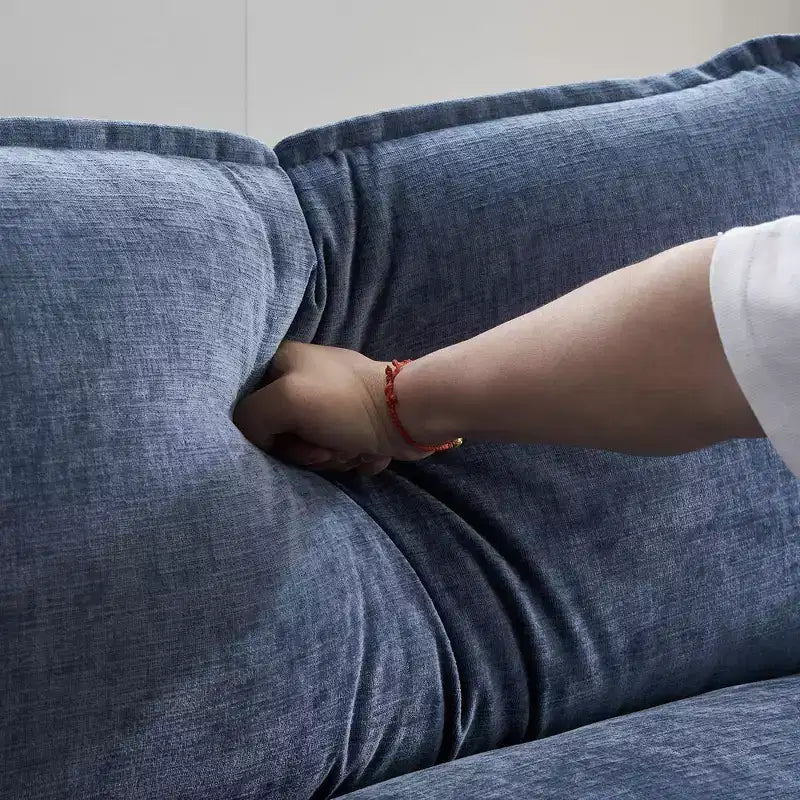 Divano moderno a L a 3 posti con braccioli e piano imbottito da 120 pollici, colore beige con pouf